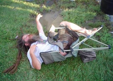 a lazy wook passed out in a knocked over lawn chair
